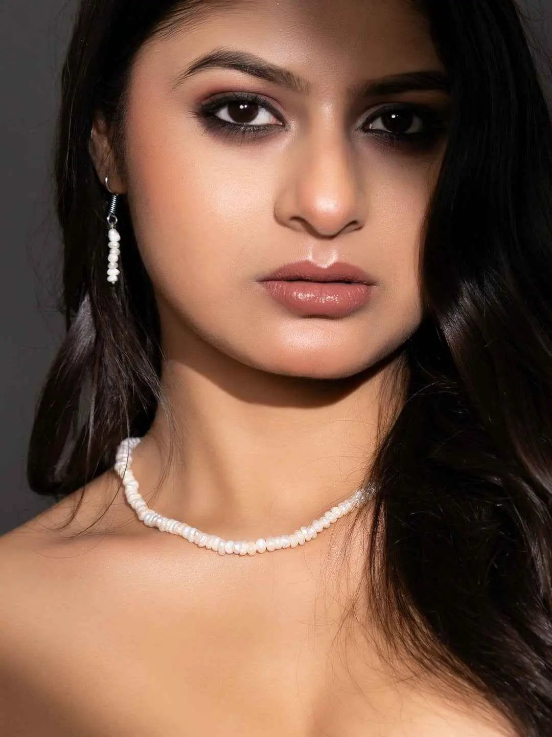 Elegant handmade pearl necklace set featuring lustrous white pearls and matching earrings