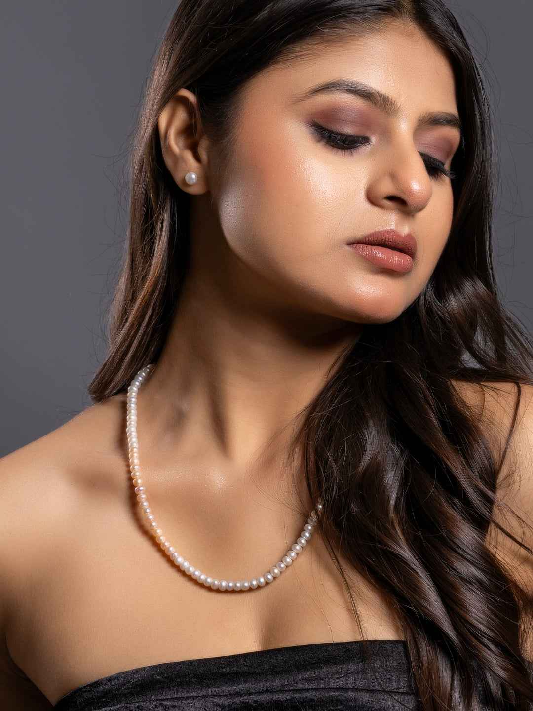 Elegant handmade pearl necklace set with a classic design, featuring lustrous white pearls