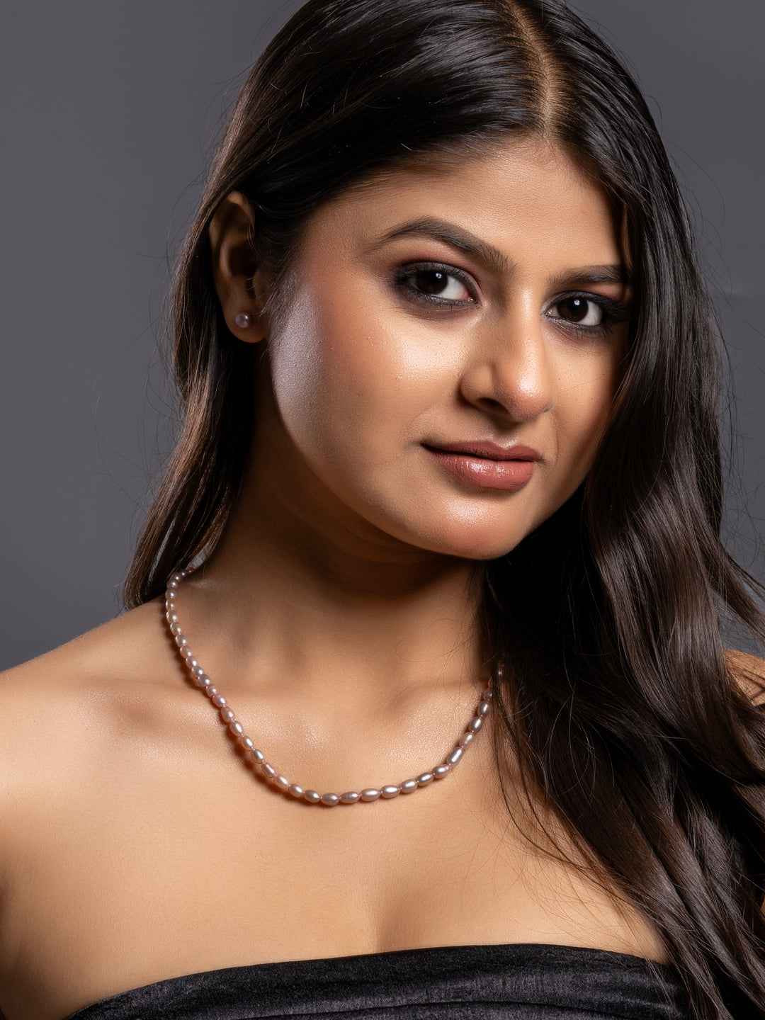 Elegant handmade pearl necklace set featuring lustrous pink pearls for a sophisticated look