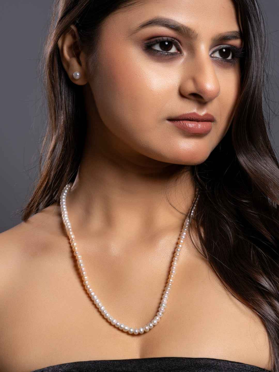 Elegant handmade pearl necklace set featuring lustrous white pearls, perfect for formal occasions