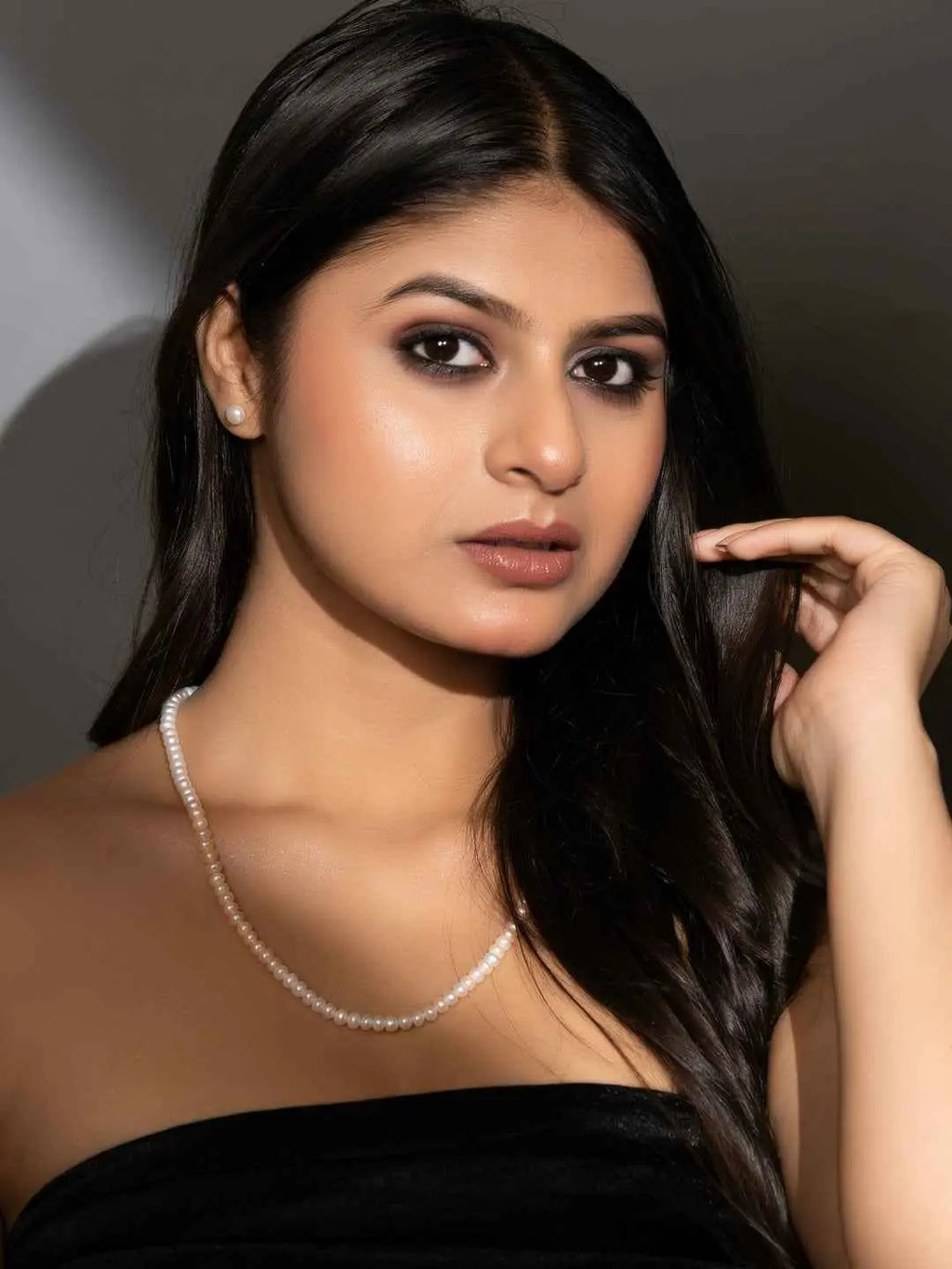 Elegant handmade pearl necklace set in lustrous white, featuring a classic design for timeless style