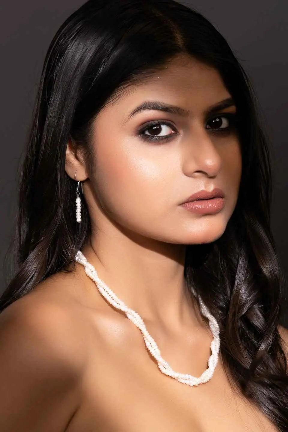 Handmade pearl necklace set in white with elegant twisted design and matching earrings