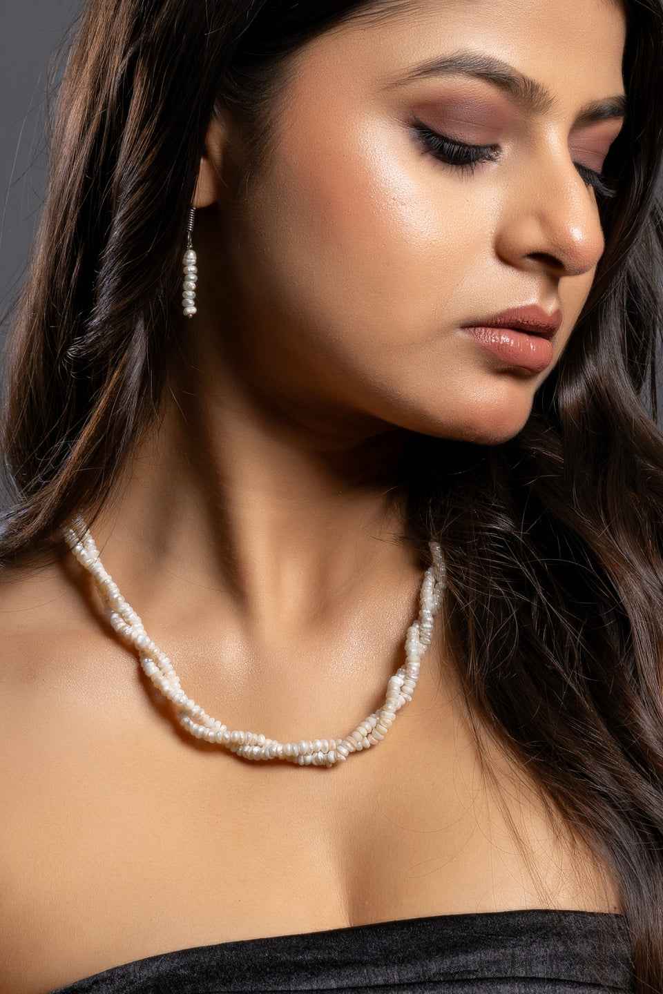 Handmade pearl necklace set in white with layered design, perfect for elegant occasions.