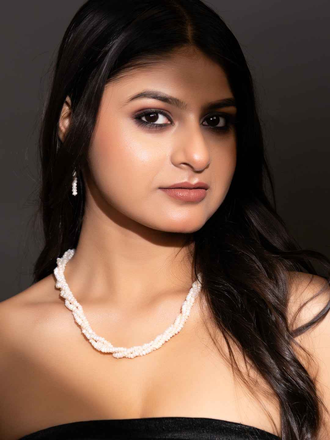 Handmade pearl necklace set in white with elegant twisted design, perfect for special occasions