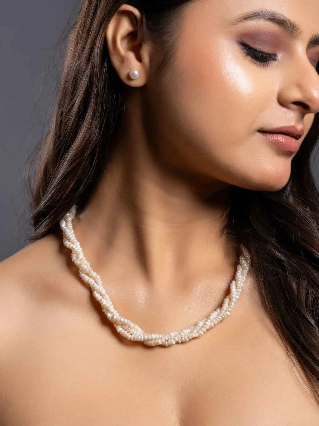 Handmade pearl necklace set in off-white with twisted strands and matching pearl stud earrings