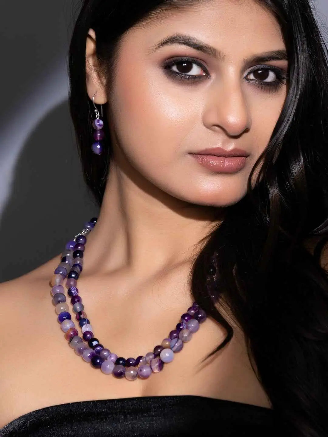 Elegant purple onyx necklace set with layered beads and matching earrings for a stylish look