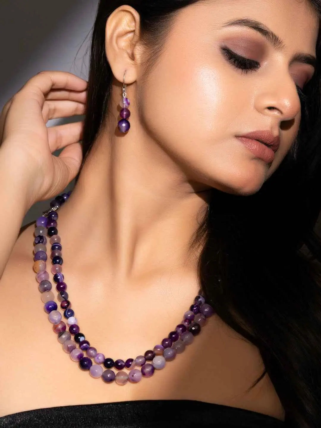 Handmade purple onyx necklace set featuring layered beads and matching earrings, perfect for elegant occasions