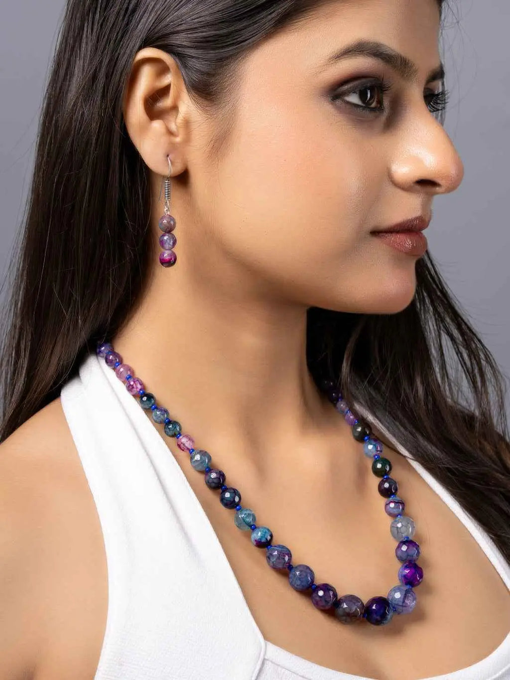 Handmade purple onyx necklace set featuring vibrant beads in various shades and matching earrings