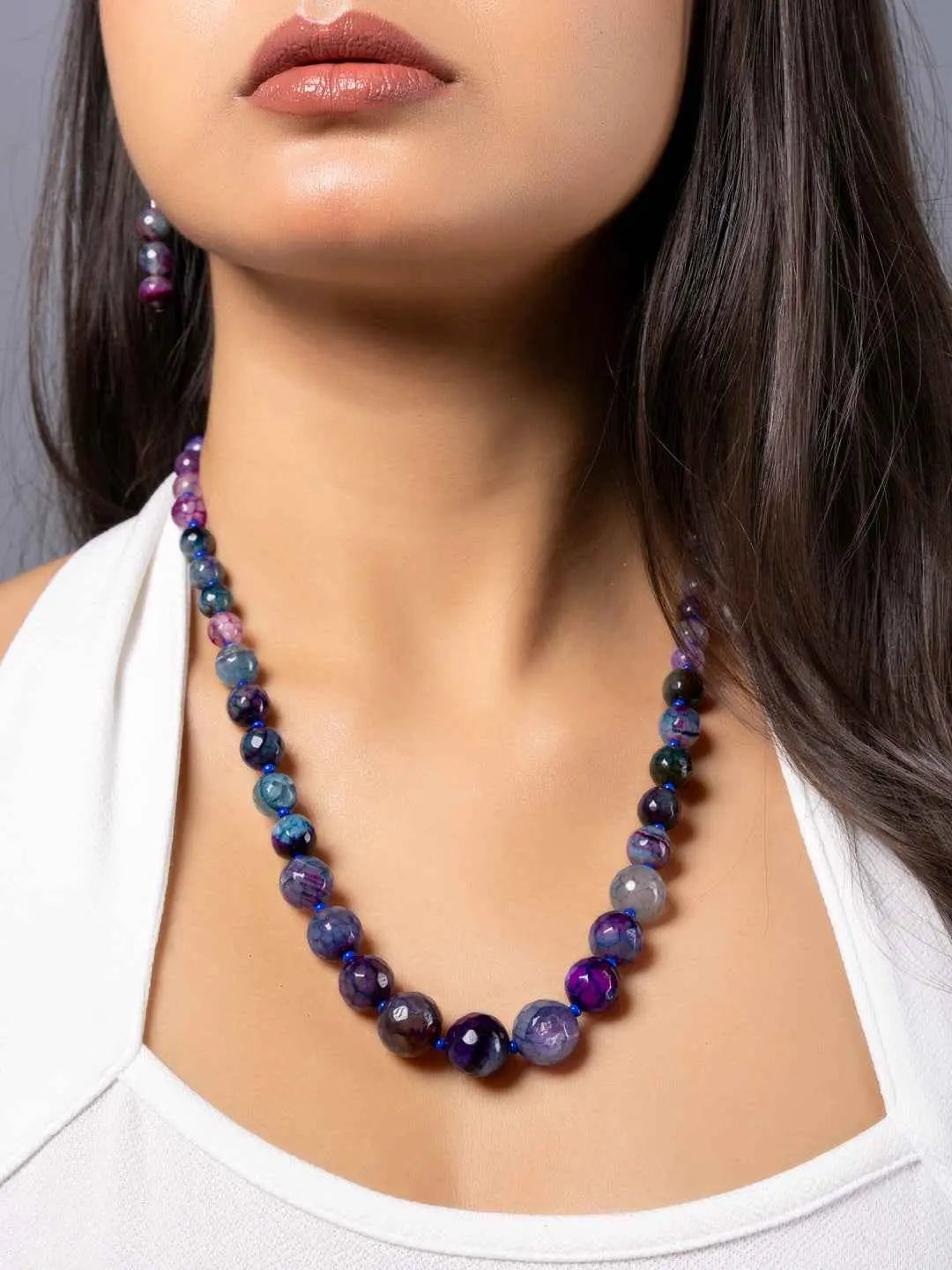 Purple onyx necklace set featuring vibrant beads in various shades and matching earrings for a stylish look