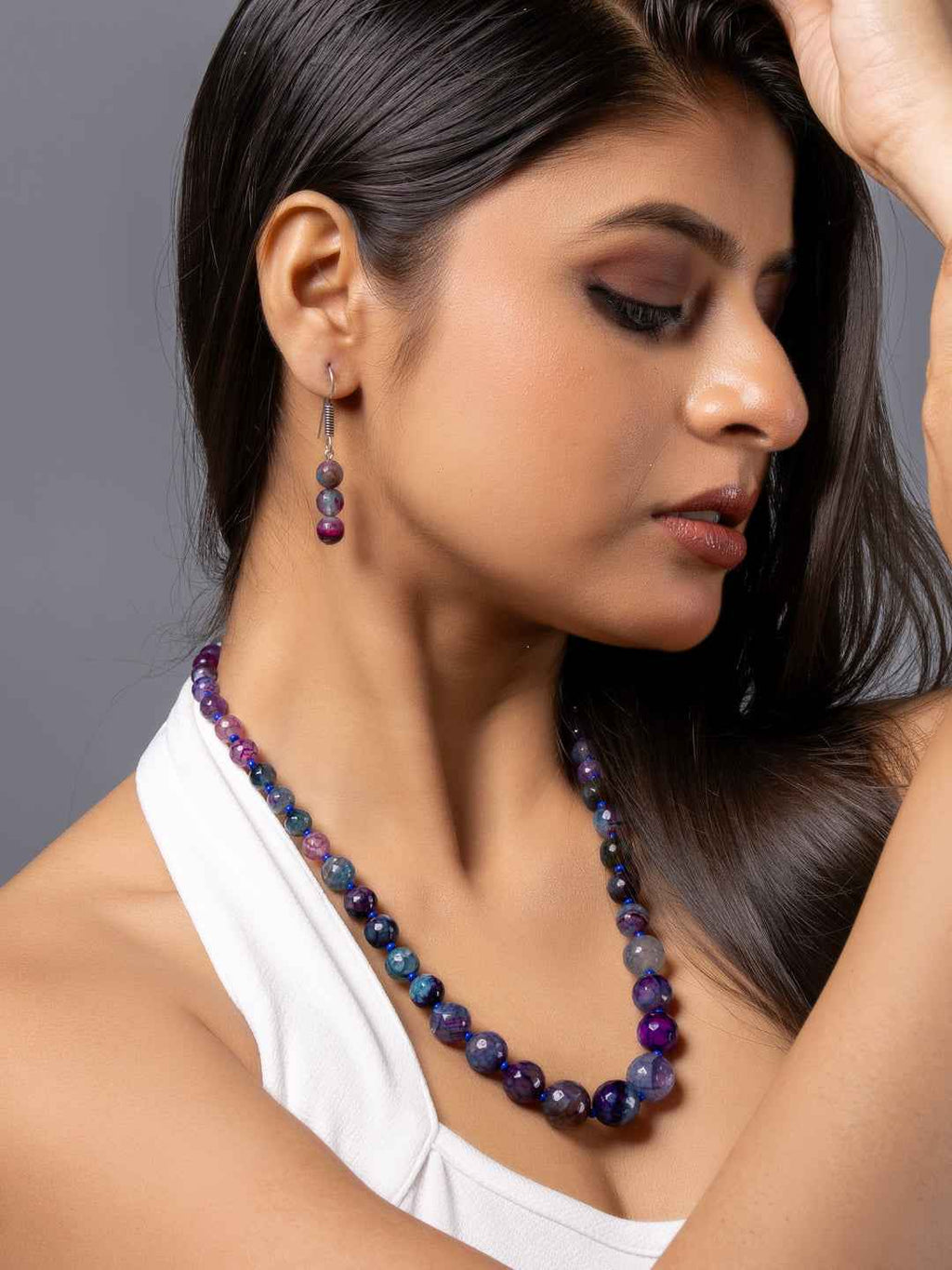 Purple onyx necklace set with matching earrings showcasing elegant round beads