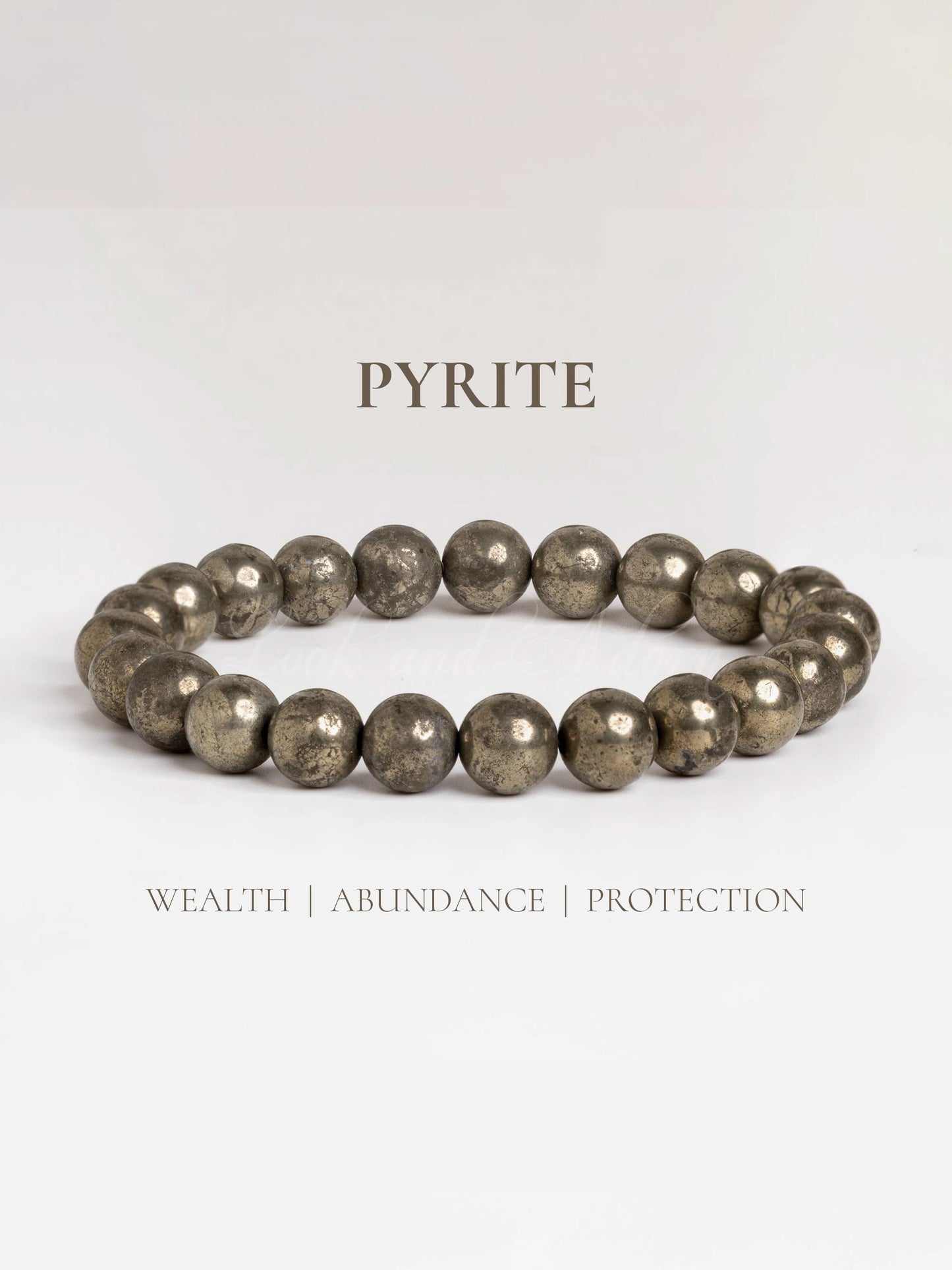 Raw pyrite bracelet designed by LOOK AND ADORN for wealth, abundance, and protection