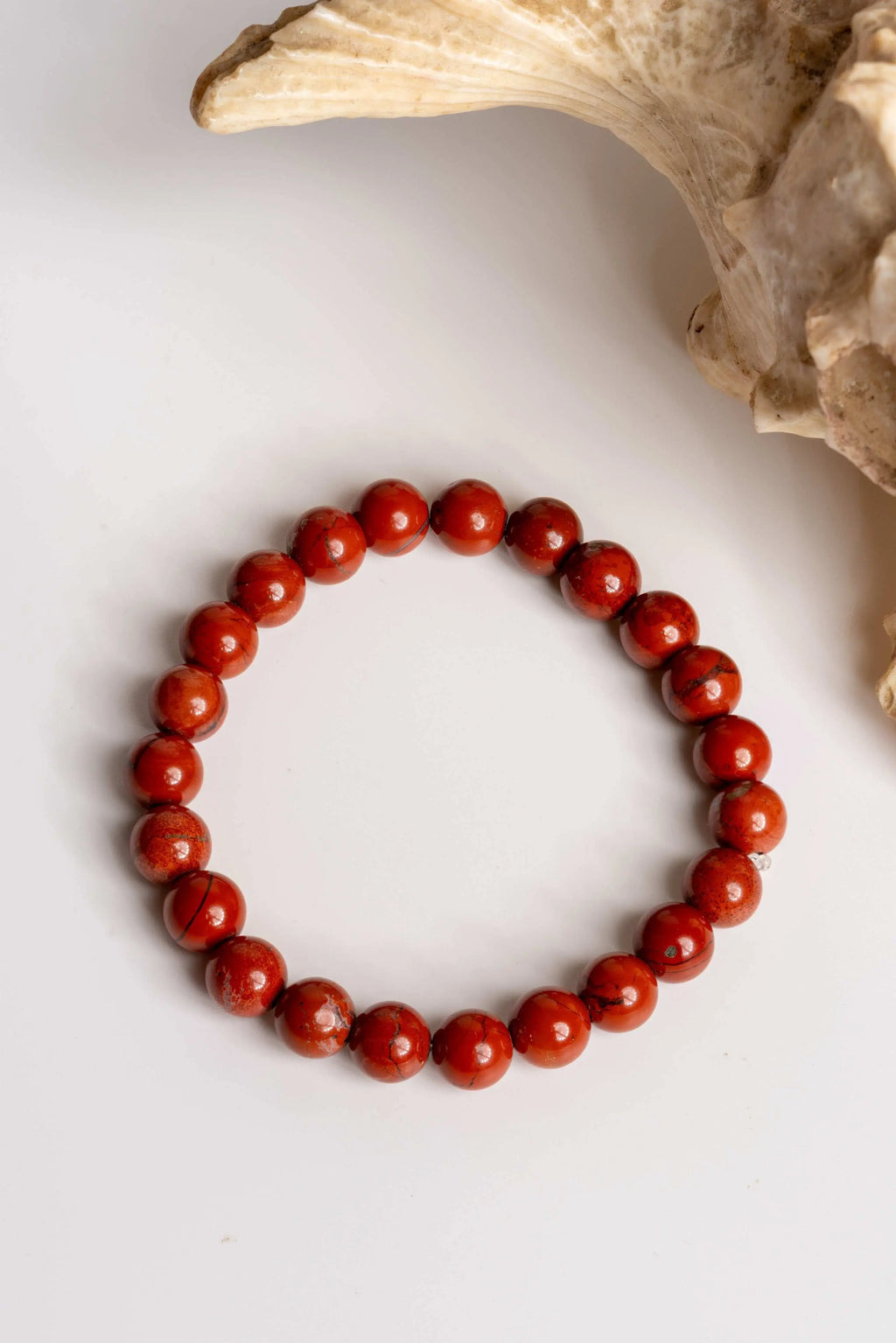 Red jasper bracelet with smooth round beads, perfect for daily wear and gemstone healing