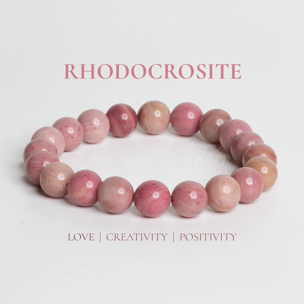 Rhodochrosite bracelet by LOOK AND ADORN featuring vibrant pink gemstones promoting love and positivity