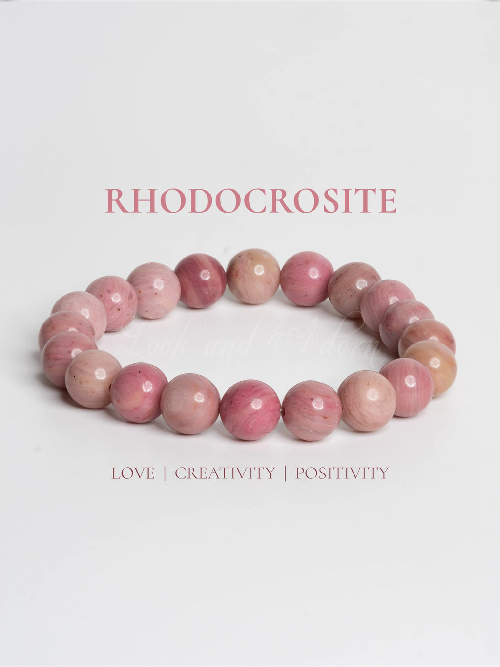 Rhodochrosite bracelet by LOOK AND ADORN featuring vibrant pink gemstones promoting love and positivity