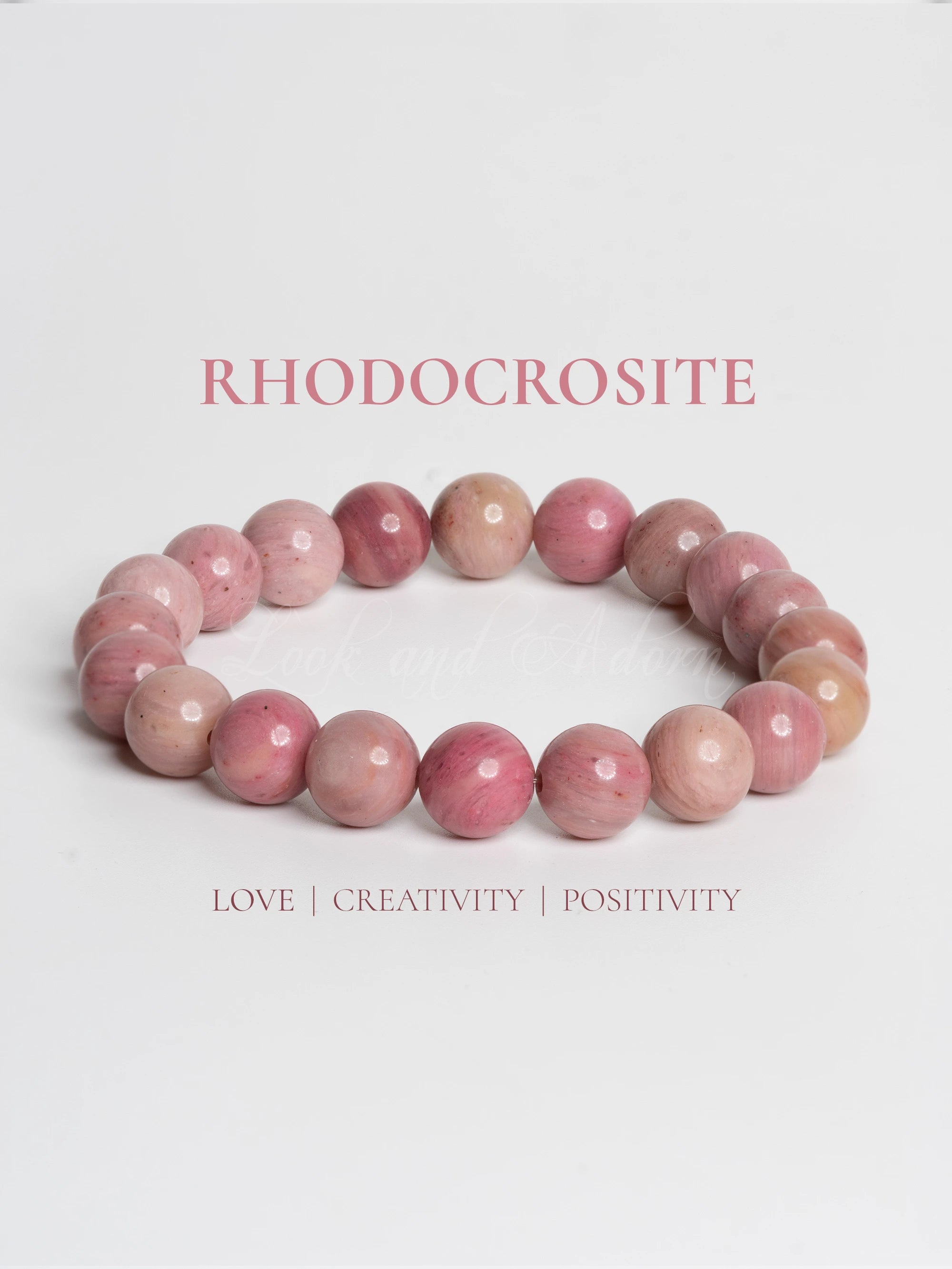 Rhodochrosite bracelet by LOOK AND ADORN featuring vibrant pink gemstones promoting love and positivity