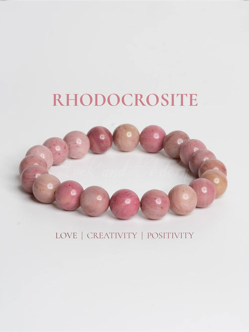 Rhodochrosite bracelet by LOOK AND ADORN featuring vibrant pink gemstones promoting love and positivity