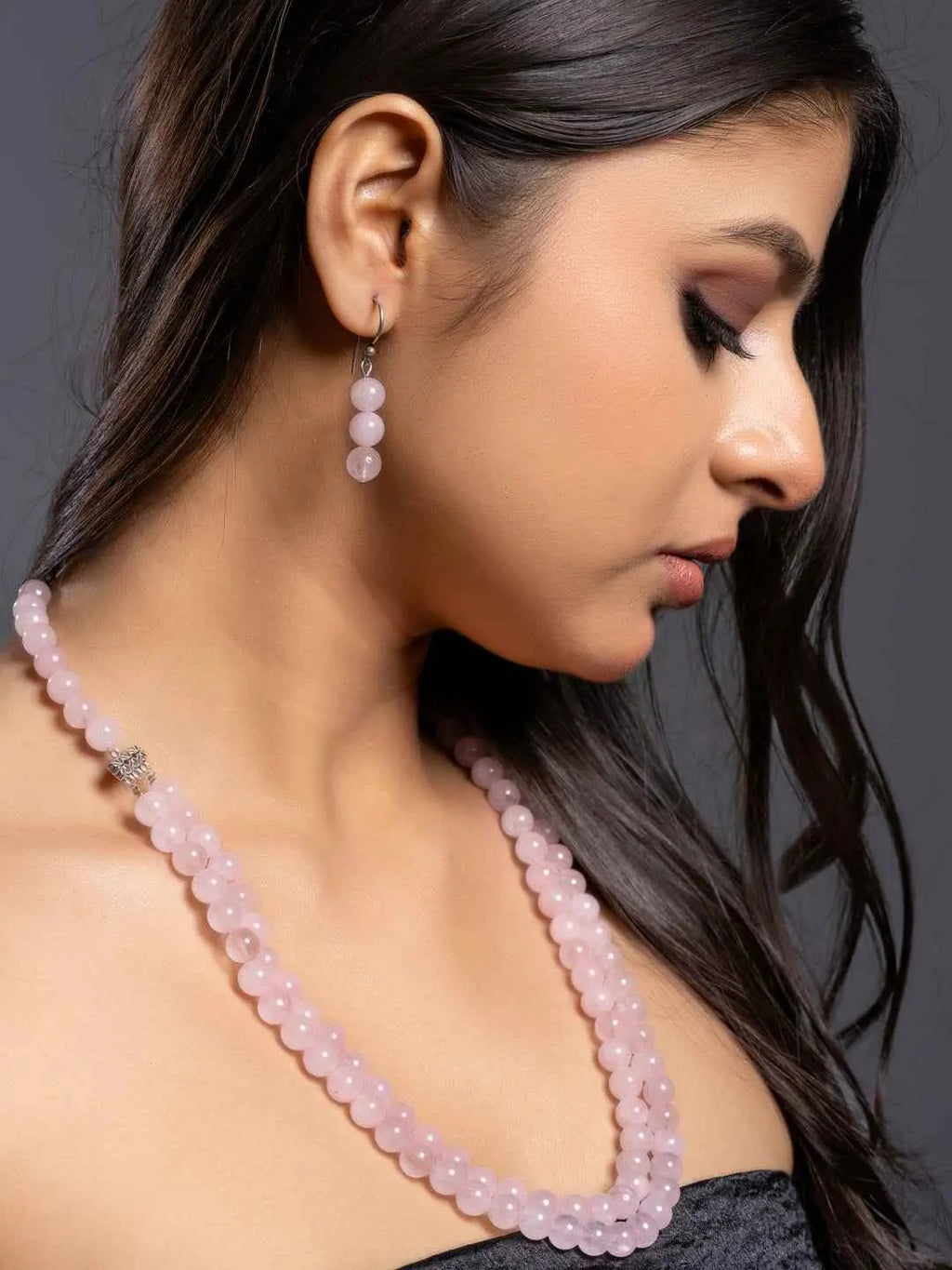 Handmade rose quartz necklace set in soft pink with matching earrings for elegant style