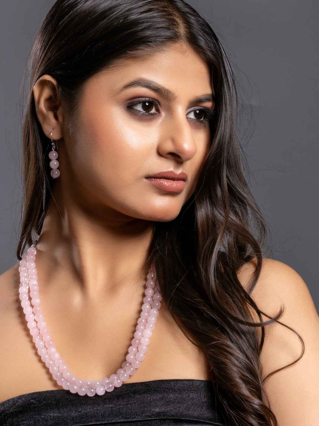 Handmade rose quartz necklace set in soft pink with matching earrings for elegant styling