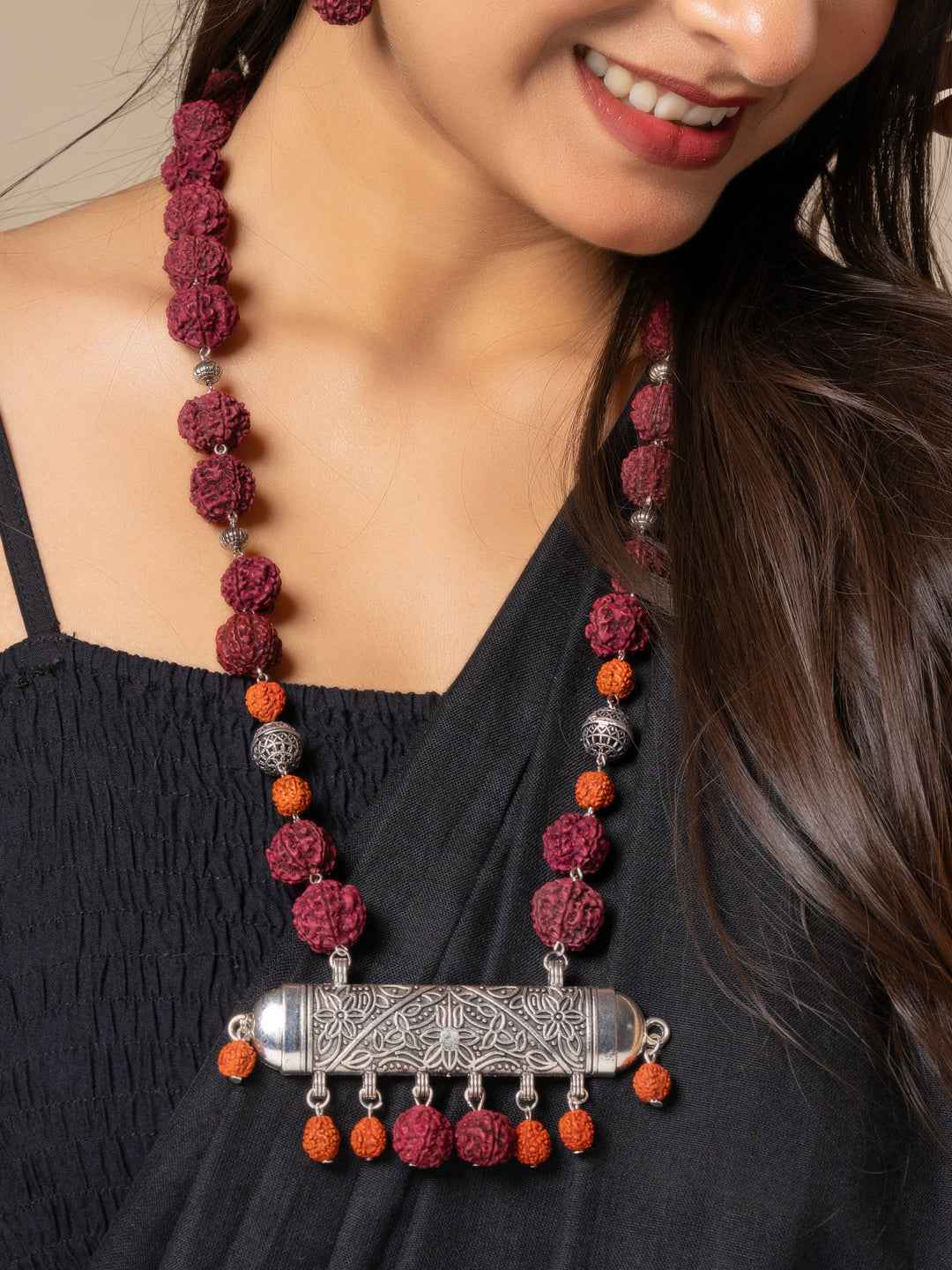 Beautiful rudraksh necklace set with maroon and orange beads, featuring a silver pendant, perfect for elegant styling