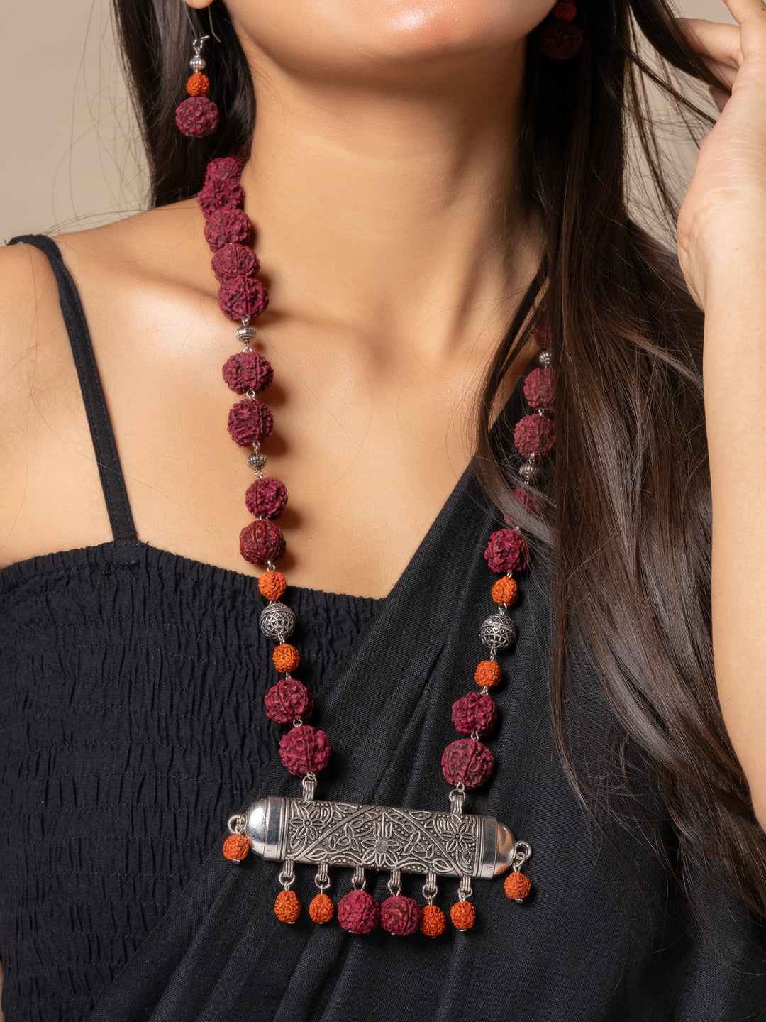 Handmade rudraksh necklace set in maroon and orange tones with silver detailing, perfect for bohemian style.