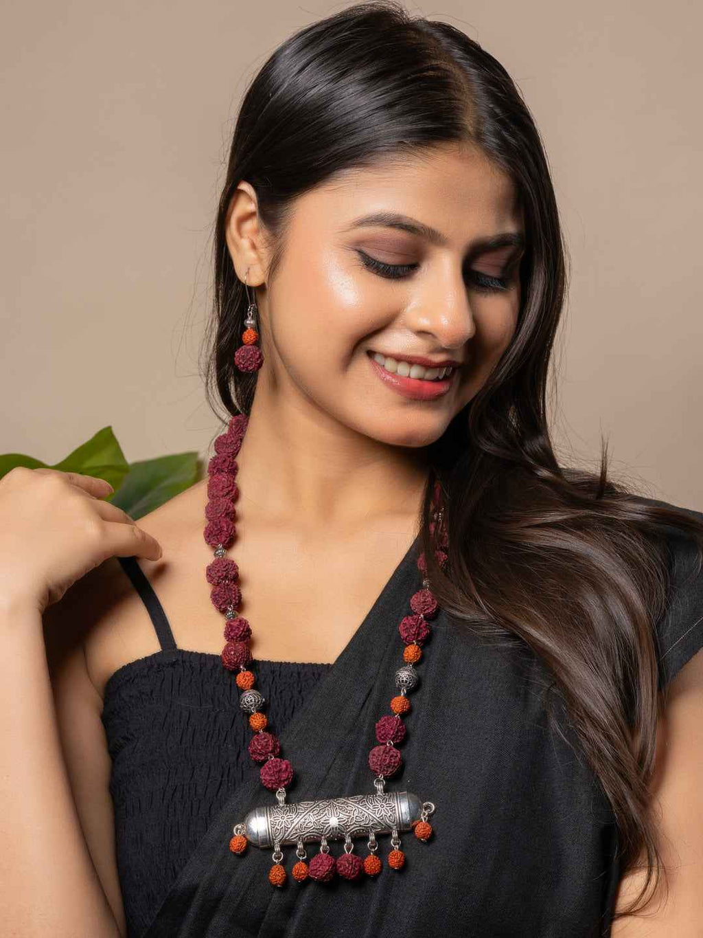Handmade rudraksh necklace set with silver pendant in rich maroon and orange colors for elegant style