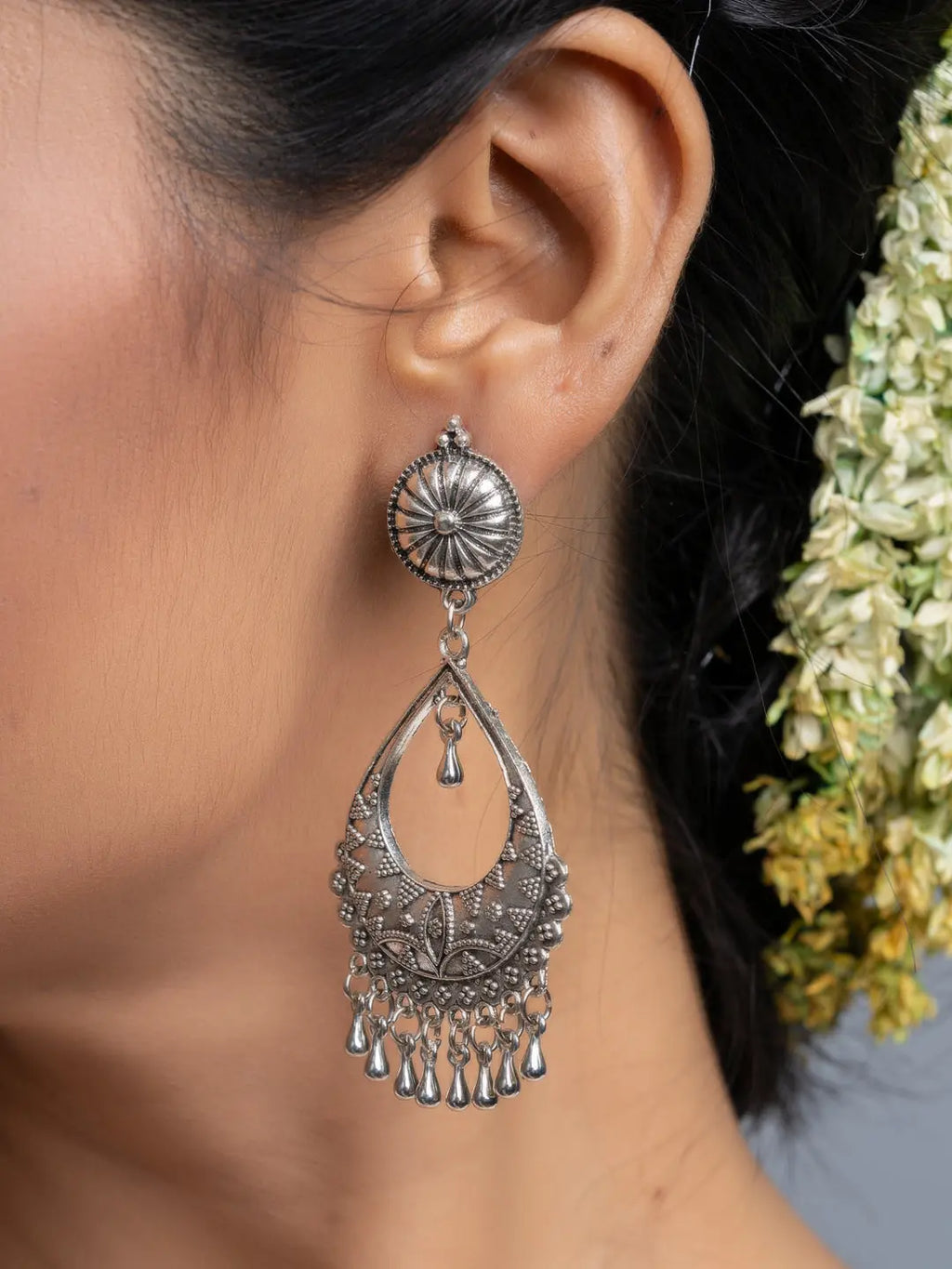 Oxidised silver chandbali earrings by LOOK AND ADORN featuring intricate designs and dangling elements