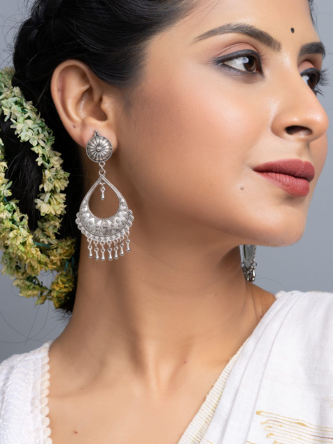 LOOK AND ADORN oxidised silver chandbali earrings worn by woman with traditional attire