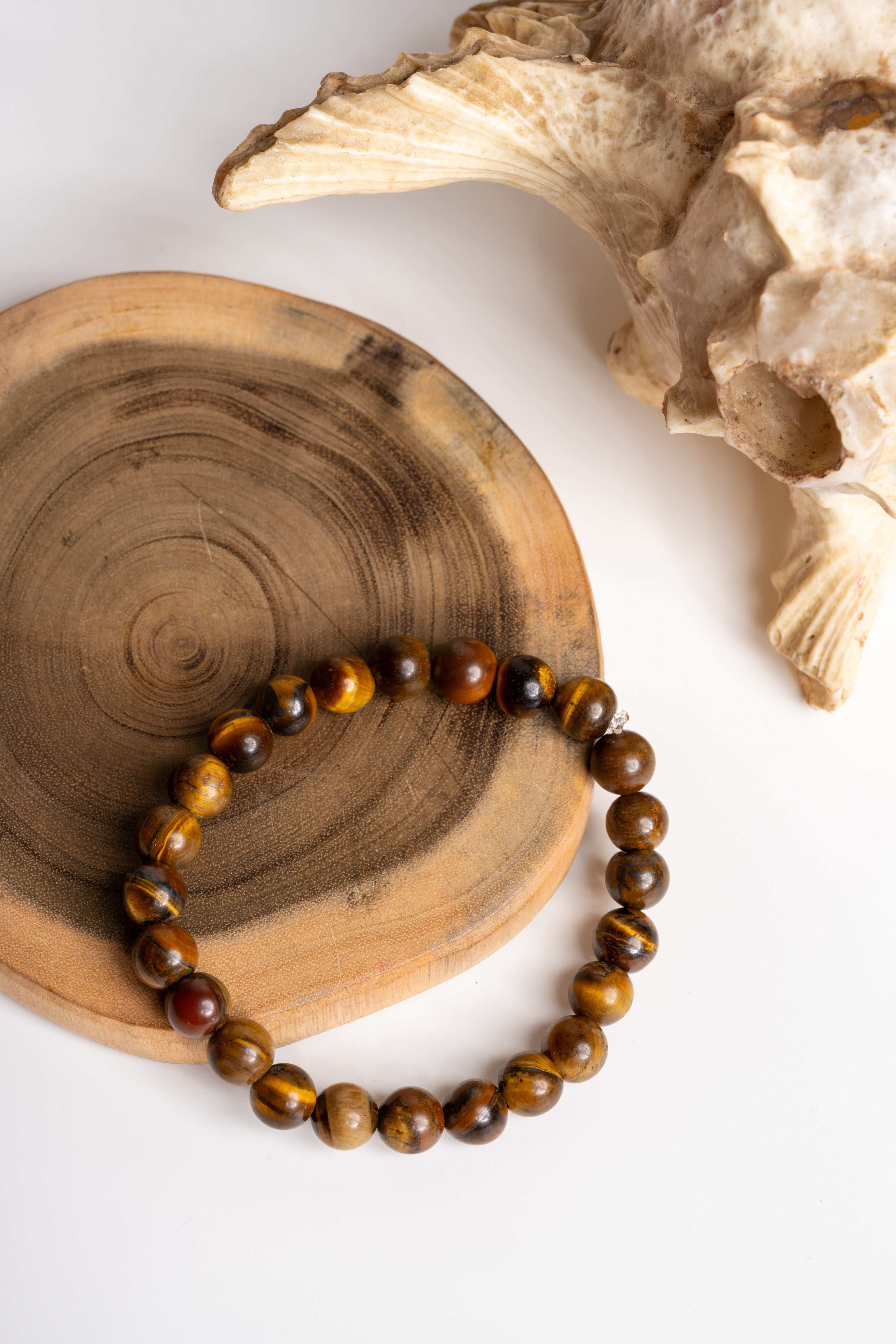 Tiger eye bracelet on wooden display for stylish and meaningful gemstone jewelry