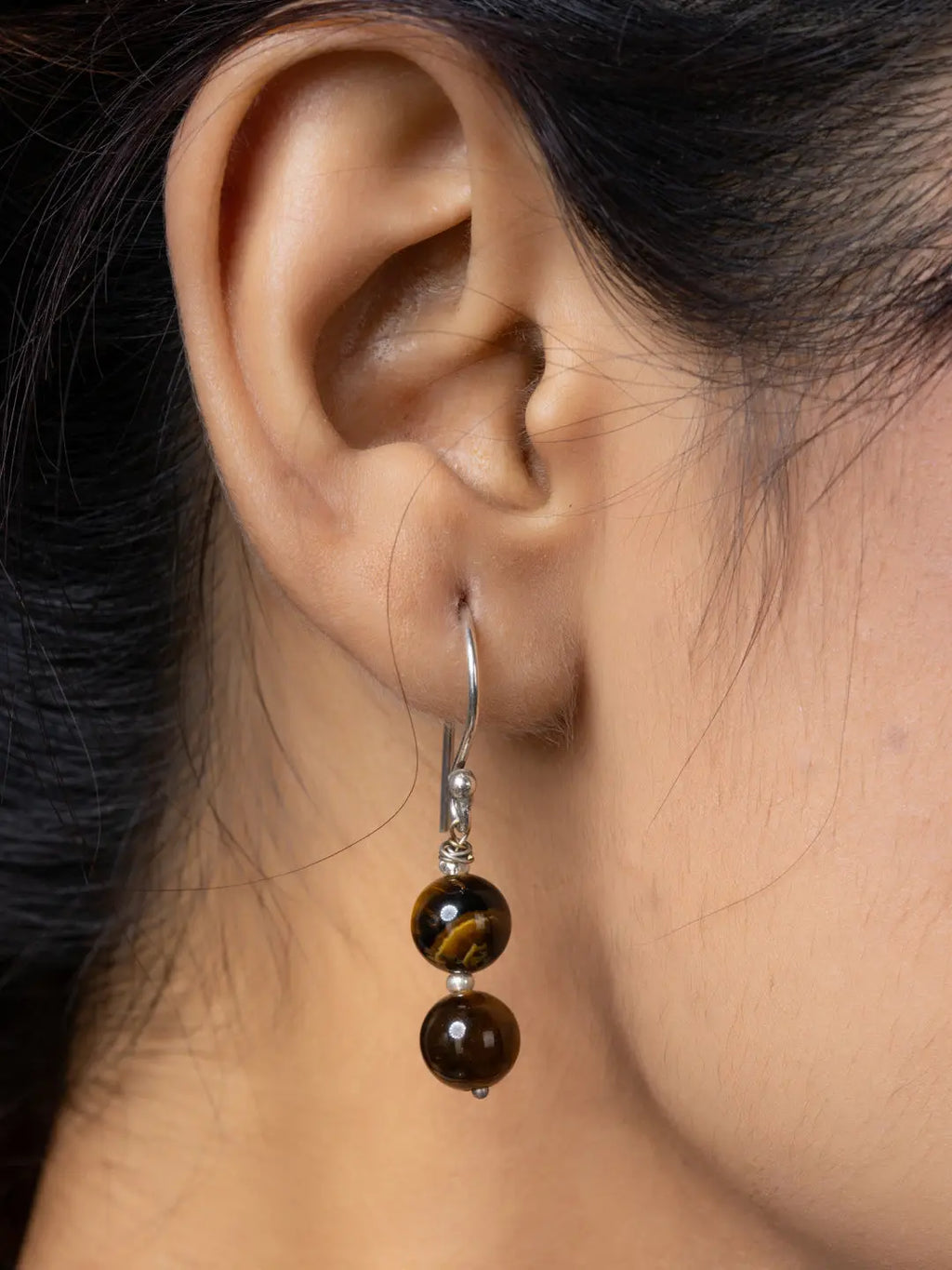 Handmade tiger eye necklace bead earrings with silver hooks worn on ear