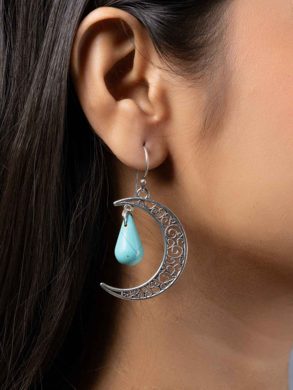 Handmade silver crescent moon earrings featuring turquoise earrings with intricate detailing