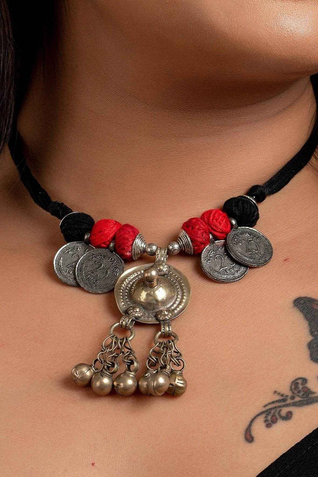 LOOK AND ADORN Afghani Necklace with silver coins red beads and intricate metal pendant on black cord