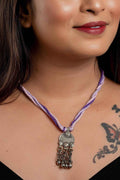 Afghani Necklace with intricate silver pendant and purple braided cord from LOOK AND ADORN