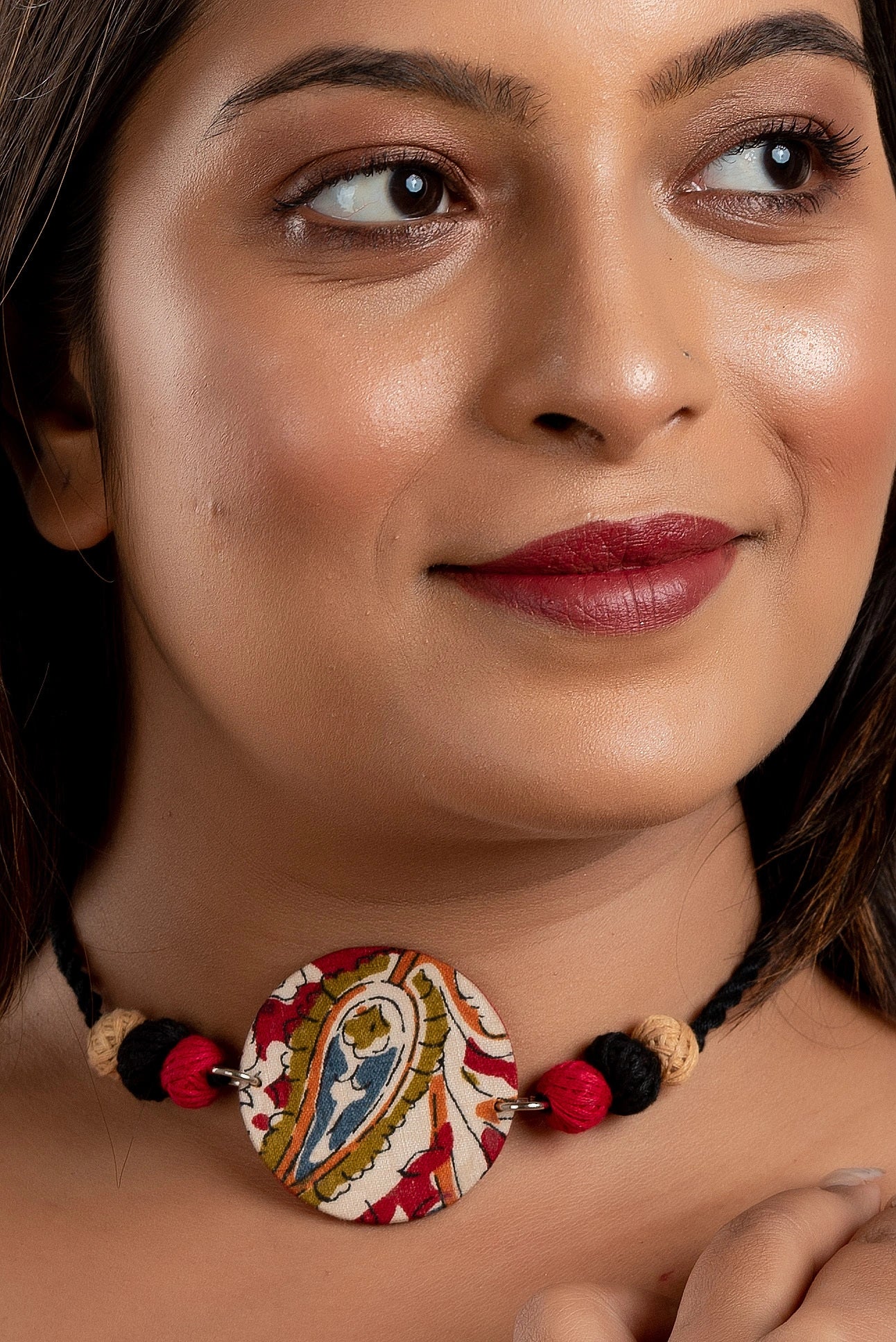 Red Black Fabric circular kalamkari choker neckpiece with thread balls and adjustable dori
